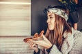 Beautiful young woman eating pizza in the restaurant Royalty Free Stock Photo