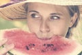 Beautiful happy young woman eating watermelon. Royalty Free Stock Photo