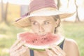 Beautiful happy young woman eating watermelon. Vegetarian food, Royalty Free Stock Photo