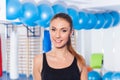 Beautiful happy young woman in gym. Gym shot. Crossfit hall. Royalty Free Stock Photo