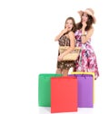 Beautiful happy young women with colored shopping sale bags in s