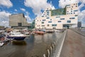 Beautiful harbor with luxury ships in front of modern office buildings in downtown Amsterdam Royalty Free Stock Photo