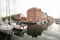 Beautiful harbor with many boats in the canal between the houses