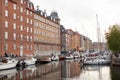 Beautiful harbor with many boats in the canal between the houses