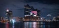 Beautiful harbour of Hamburg with Elbphilharmonie concert hall by night - HAMBURG, GERMANY - DECEMBER 25, 2020 Royalty Free Stock Photo