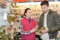 Beautiful hardwarestore saleswoman helping customer Royalty Free Stock Photo