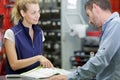 beautiful hardwarestore saleswoman helping customer Royalty Free Stock Photo