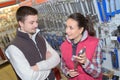 beautiful hardwarestore saleswoman helping customer Royalty Free Stock Photo