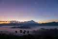 Beautiful harmony romantic color sunrise landscape scenery with sunlight and fog and Mount Kinabalu Royalty Free Stock Photo