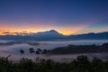 Beautiful harmony romantic color sunrise landscape scenery with sunlight and fog and Mount Kinabalu Royalty Free Stock Photo