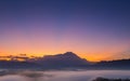 Beautiful harmony romantic color sunrise landscape scenery with sunlight and fog and Mount Kinabalu Royalty Free Stock Photo