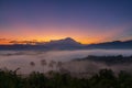 Beautiful harmony romantic color sunrise landscape scenery with sunlight and fog and Mount Kinabalu Royalty Free Stock Photo