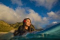 Beautiful hawaiian girl on surboard