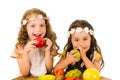 Beautiful healthy little girls eating delicious