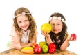 Beautiful healthy little girls holding delicious Royalty Free Stock Photo