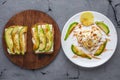 Beautiful healthy romantic Breakfast of fried eggs in the shape of a heart on a white plate and avocado sandwiches Royalty Free Stock Photo