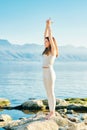 Beautiful healthy woman practicing yoga exercises outside Royalty Free Stock Photo