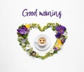 Beautiful heart made of different flowers and coffee on white background, top view. Good morning Royalty Free Stock Photo