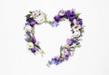 Beautiful heart made of different flowers on white background, top view Royalty Free Stock Photo