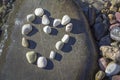 Beautiful heart made of stones over the rock Royalty Free Stock Photo