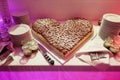 Beautiful heart shaped fruity wedding cake at wedding reception