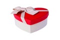 Beautiful Heart-shaped red white gift box with bow. Happy Women`s Day or Christmas and New Year present gift. Isolated Royalty Free Stock Photo