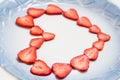 Beautiful heart symbol from chopped red juicy strawberry Royalty Free Stock Photo