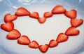 Beautiful heart symbol from chopped red juicy strawberry Royalty Free Stock Photo