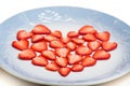 Beautiful heart symbol from chopped red juicy strawberry Royalty Free Stock Photo