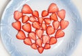 Beautiful heart symbol from chopped red juicy strawberry Royalty Free Stock Photo