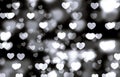 Beautiful hearts on dark background. Bokeh hearts concept