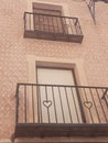 beautiful hearts wrought in iron from the balcony of a house in the Spanish city of Segovia on an autumn morning