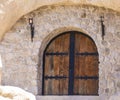 beautiful heavy wooden door to a stone cave