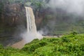 Beautiful hidden Ekom Waterfall deep in the tropical rain forest of Cameroon, Africa