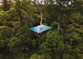 Beautiful high angle view of a treehouse in a green dense forest
