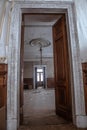 A beautiful high doorway in an old abandoned manor house. Old wooden doors. Royalty Free Stock Photo