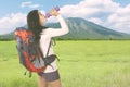 Beautiful hiker woman drinking in the mountain