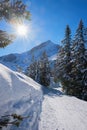 Wintry hiking path garmisch area with view to alpspitze mountain