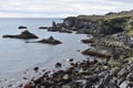 Hiking trail from Anarstapi to Hellnar with the raw ocean und big rocks and mountains in the west of Iceland at Snaefellsnes Penin