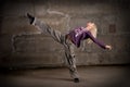 Beautiful hip-hop girl dancing over brick wall Royalty Free Stock Photo