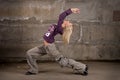 Beautiful hip-hop girl dancing over brick wall Royalty Free Stock Photo