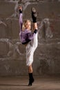 Beautiful hip hop girl dancing over grey wall Royalty Free Stock Photo