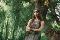 Beautiful hippie girl on the background of a forest lake Royalty Free Stock Photo
