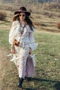 Beautiful hippie girl in hat walking on nature Royalty Free Stock Photo