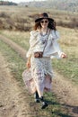 Beautiful hippie girl in hat walking on nature Royalty Free Stock Photo