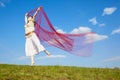 Beautiful hippie girl with red fabric Royalty Free Stock Photo