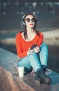 Beautiful hipster girl in sunglasses listening music Royalty Free Stock Photo