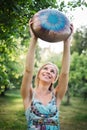 Woman with authentic drum musical instrument