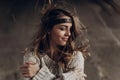 Beautiful hipster woman in boho indie clothes, posing in winter Royalty Free Stock Photo