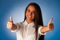 Beautiful hispanic business woman gesturing success shownig thumb up Royalty Free Stock Photo